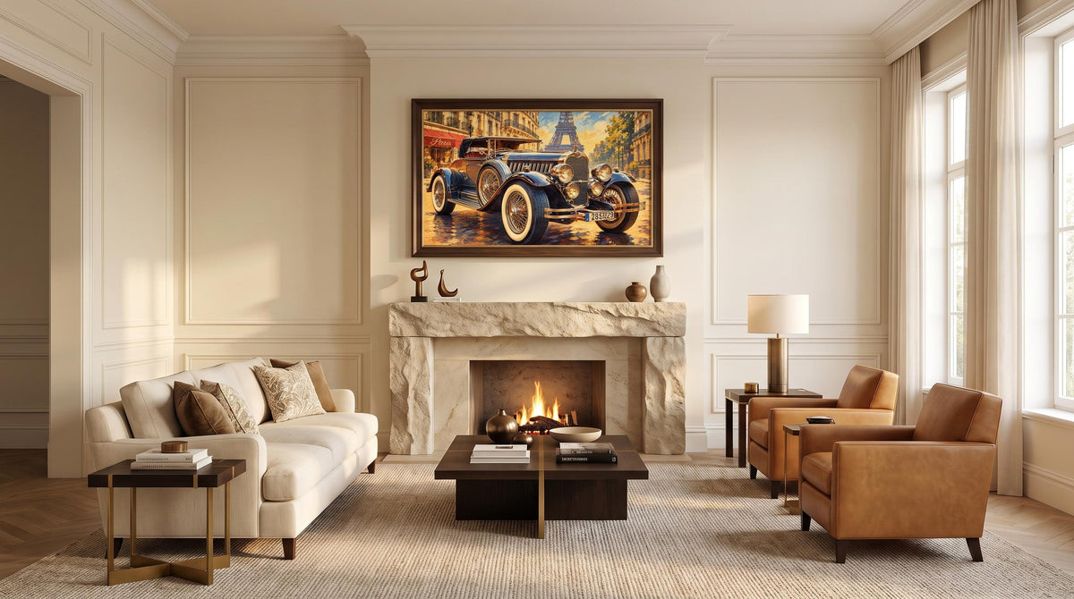 A framed vintage car painting hangs above a fireplace in a styled living room with a cream sofa, brown leather armchairs, a coffee table, and a lit fireplace.